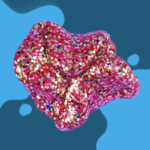 Colorful abstract shape with glittery texture on blue background.