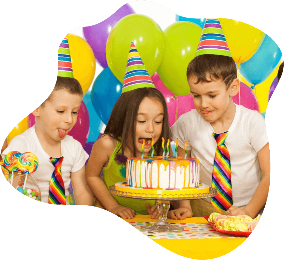 Three children celebrating a birthday with cake and party hats.