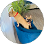 Person sitting with small dog outdoors